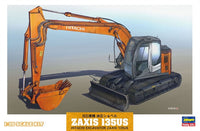 Model kit of a Hitachi excavator on a gradient background