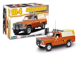 Model kit packaging of a 1970s-style pickup truck with camper top, featuring 'Good Buddy!' branding from Revell.
