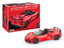 Red Corvette model car with packaging on a white background